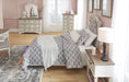 Realyn Chipped White Twin Upholstered Bed - Gate Furniture